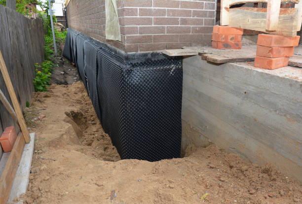 SJ Waterproofing Pros technician performing targeted Sump Pump Installation assessment in Youngstown, OH
